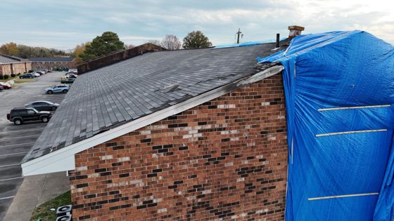 Storm-Damaged Roof — Tarped